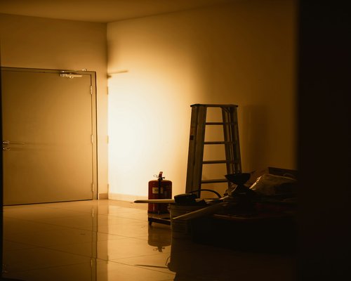 Person holding a smartphone in a dimly lit room at night