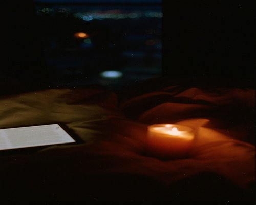 Quiet evening scene with a candle and a book